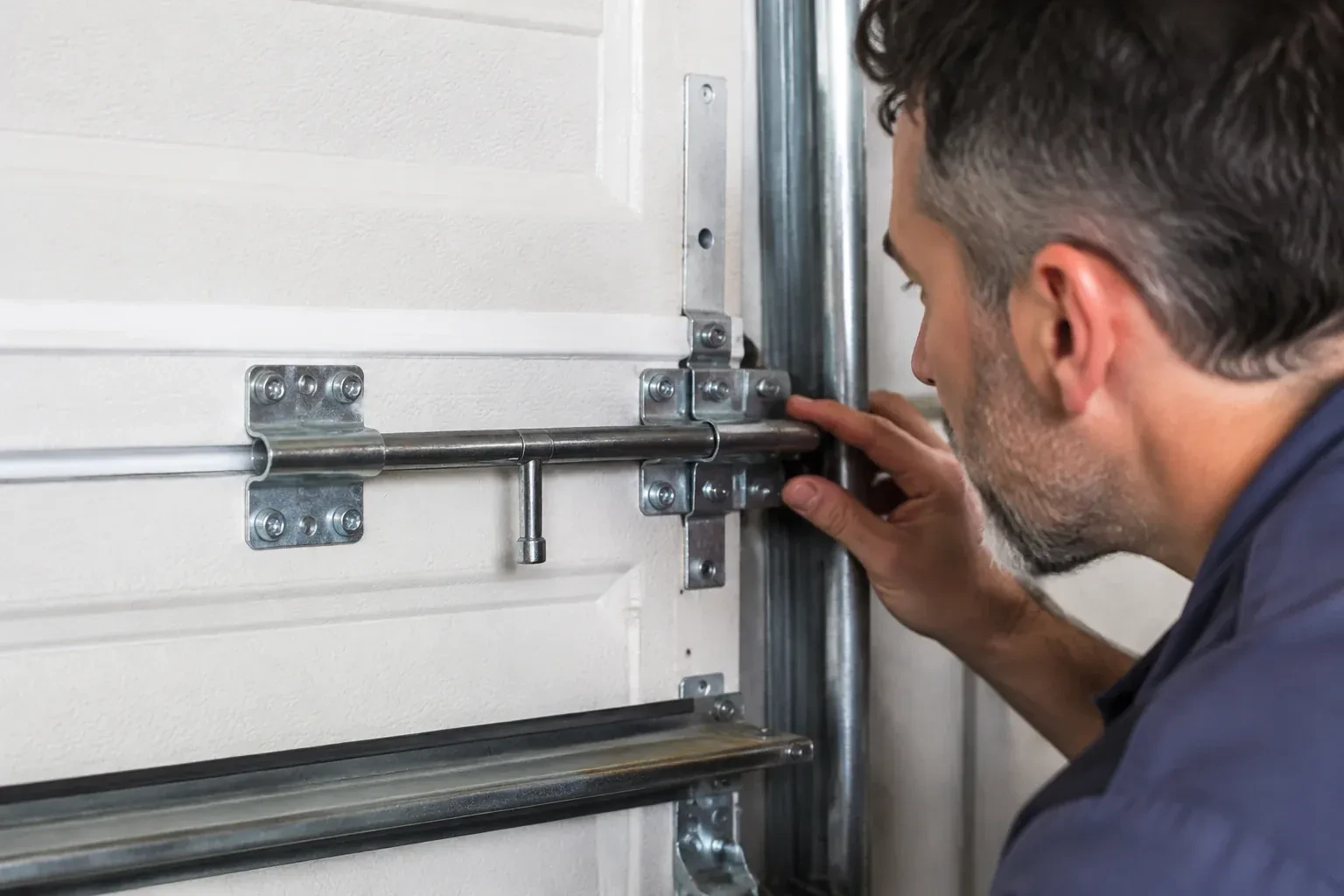 Illustrative garage doors scene; not an actual job — Garage Door Manual Lock Repair, Grimsby